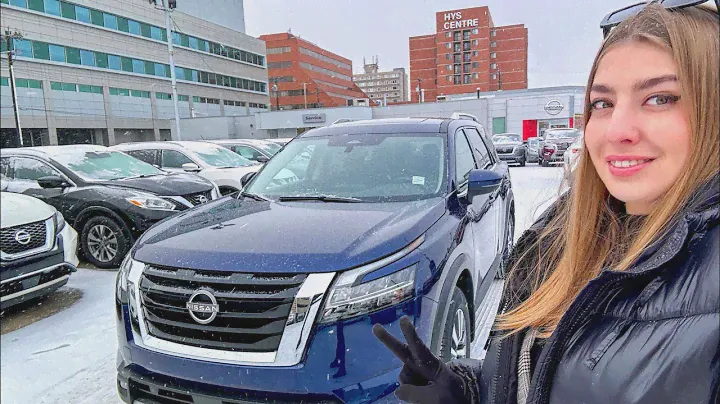 2024 Nissan Pathfinder SL Deep Ocean Blue Pearl Exterior - review from a dealership in a snow storm